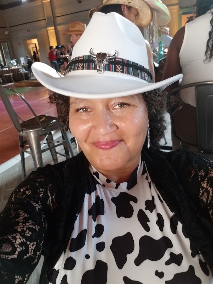 Tiffani Gaiters's Image with her iconic Cowgirl hat